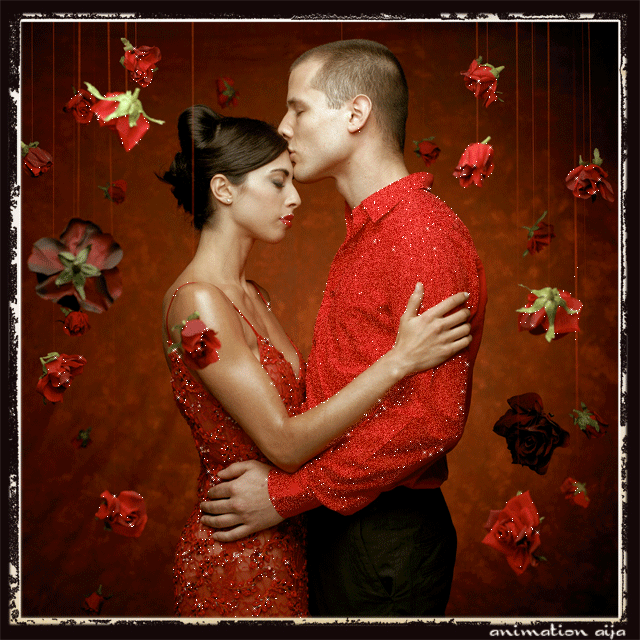 Русский парень целует девушку в красном в лоб